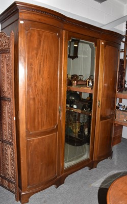 Lot 1410 - An Edwardian double bow fronted wardrobe,...