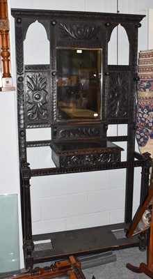 Lot 1416 - An ornately carved stained oak Victorian...