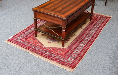 Lot 1211 - An Indian rug, the ivory lozenge field with...