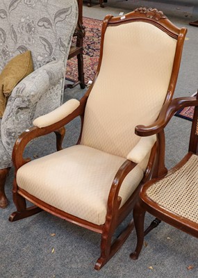 Lot 1367 - A carved oak rocking chair