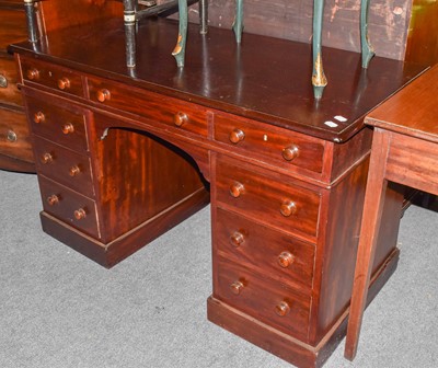 Lot 1333 - A 20th century mahogany twin pedestal desk...