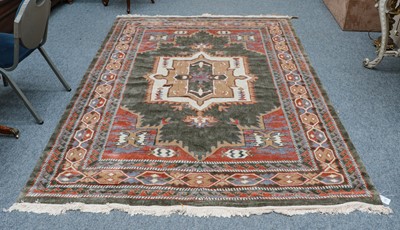 Lot 1206 - A machine made carpet of oriental design, the...