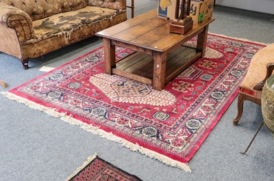 Lot 1209 - A machine made carpet of Caucasian design, the...