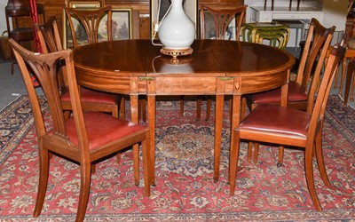 Lot 1284 - A crossbanded and inlaid mahogany D-end dining...