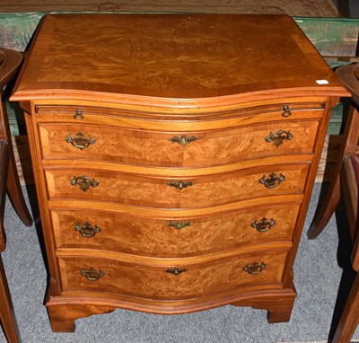 Lot 1282 - A reproduction serpentine fronted four height...