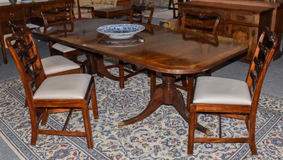 Lot 1252 - A reproduction dining suite comprising,...