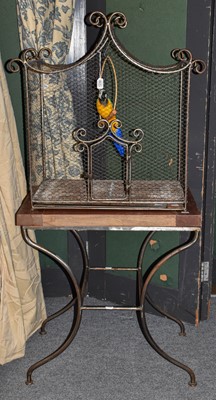 Lot 1248 - A 20th century wrought metal mesh bird cage on...