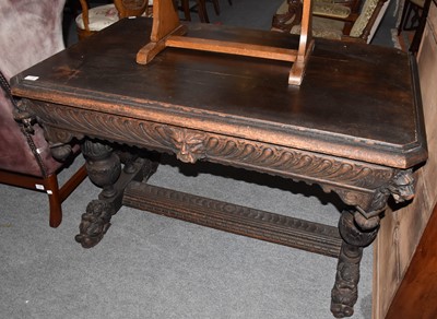 Lot 1346 - A Victorian carved oak table, the moulded top...