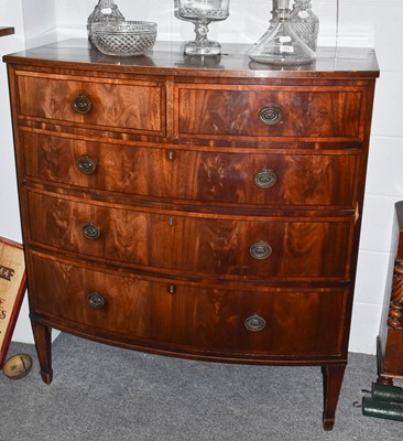 Lot 1420 - A George III cross banded mahogany four height...