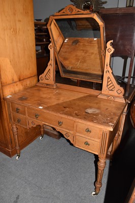 Lot 1396 - A 19th century pine triple wardrobe, fitted...