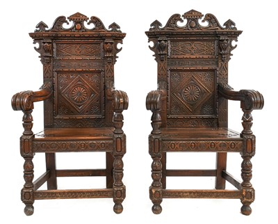 Lot 751 - ~ A Pair of Victorian Carved Oak Armchairs, in...