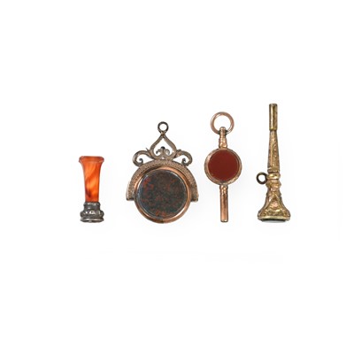 Lot 2063 - A Victorian Gold Fob-Seal, Three Gilt-Metal Fob or Desk Seals and Two Gilt Metal Watch-Keys