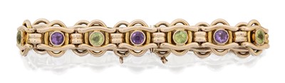 Lot 2065 - A Peridot and Amethyst Bracelet