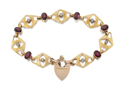 Lot 2026 - A Garnet and Split Pearl Bracelet