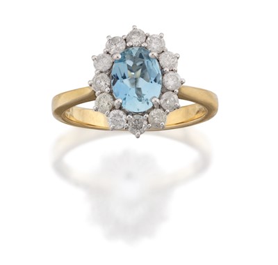 Lot 2163 - An 18 Carat Gold Aquamarine and Diamond Cluster Ring