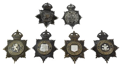 Lot 2048 - Five Blackened Die Stamped Brass Helmet Plates,...