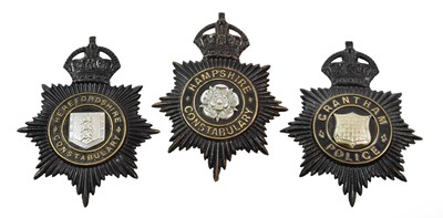 Lot 2049 - Three Blackened Die Stamped Brass Helmet...