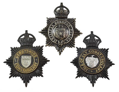 Lot 2050 - Two Blackened Die Stamped Brass Helmet Plates,...
