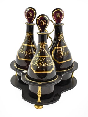 Lot 207 - A Set of Three Amethyst Glass Mallet Decanters...