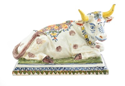 Lot 270 - A Dutch Delft Model of a Recumbent Cow,...