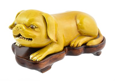 Lot 308 - A Chinese Yellow-Glazed Porcelain Figure of a...