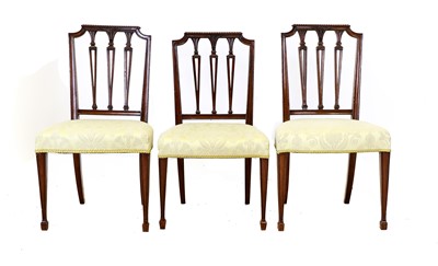 Lot 97 - A Harlequin Set of Six Sheraton-Style Carved...