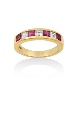 Lot 2052 - An 18 Carat Gold Ruby and Diamond Half Hoop...