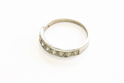 Lot 15 - A Diamond Half Hoop Ring, the round brilliant...