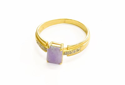 Lot 79 - A Jade and Diamond Ring, the step cut jade in...