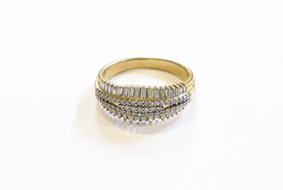 Lot 127 - A 9 Carat Gold Diamond Ring, seven graduated...