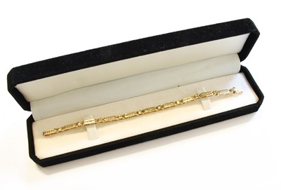 Lot 118 - A Diamond Line Bracelet, stamped '10K', length...