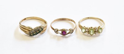 Lot 112 - A Peridot and Diamond Ring, unmarked, finger...