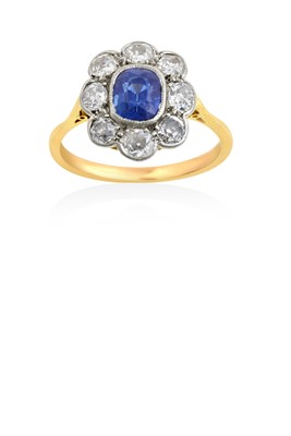 Lot 2019 - A Sapphire and Diamond Cluster Ring the...