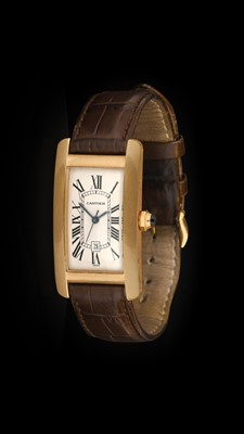 Lot 2245 - Cartier: An 18 Carat Gold Automatic Calendar...