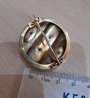Lot 2047 - An Emerald and Split Pearl Brooch the circular...