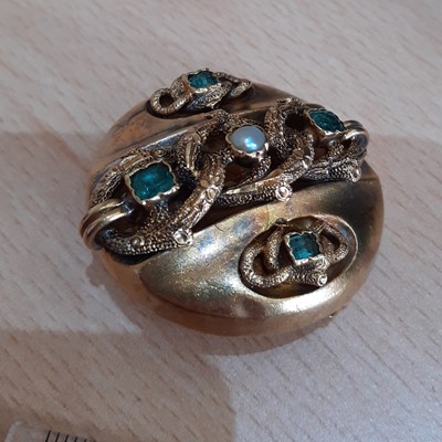 Lot 2047 - An Emerald and Split Pearl Brooch the circular...