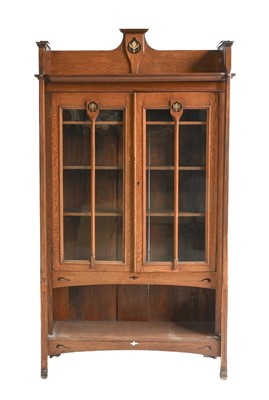 Lot 647 - An Arts & Crafts Inlaid Oak Glazed Bookcase,...
