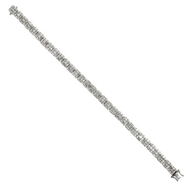Lot 2228 - A Diamond Line Bracelet thirty-one clusters...