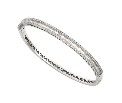 Lot 2276 - A Diamond Bangle the baguette cut diamonds...