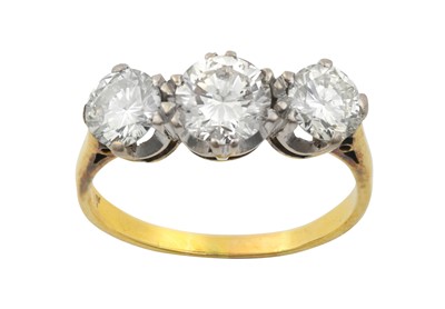 Lot 2302 - A Diamond Three Stone Ring the graduated round...