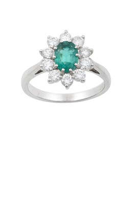Lot 2254 - An 18 Carat White Gold Emerald and Diamond...
