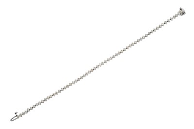 Lot 2325 - A Diamond Line Bracelet the sixty-two round...