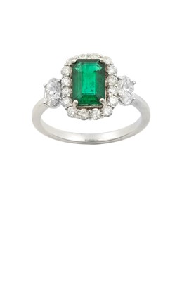 Lot 2256 - An Emerald and Diamond Cluster Ring the...