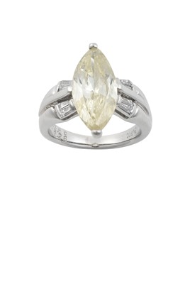 Lot 2335 - A Diamond Ring the fancy yellow marquise cut...