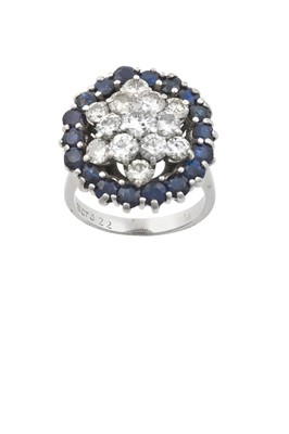 Lot 2227 - A Sapphire and Diamond Cluster Ring the raised...