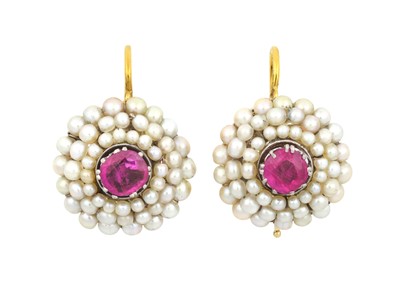Lot 2312 - A Pair of Ruby and Pearl Earrings the round...