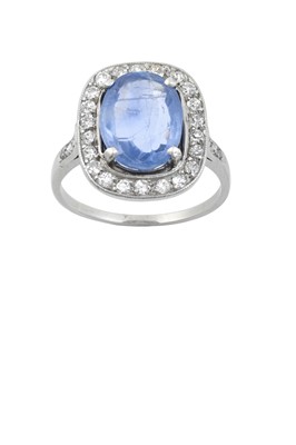 Lot 2222 - A Sapphire and Diamond Cluster Ring the oval...