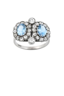 Lot 2235 - An Aquamarine and Diamond Double Cluster Ring...