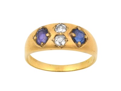Lot 52 - A Sapphire and Diamond Four Stone Ring, the...