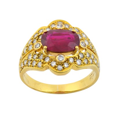 Lot 2215 - A Ruby and Diamond Ring the oval cut ruby in a...